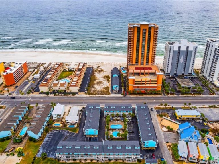 Aerial view of Lani Kai on West Beach Blvd in Gulf Shores with the beach and high-rises nearby